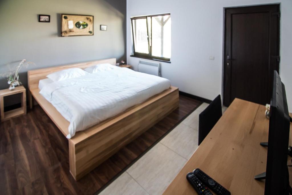 Postel nebo postele na pokoji v ubytování Casa Patru Anotimpuri