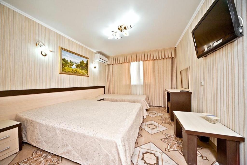 
Кровать или кровати в номере Гостиница Венера 3

