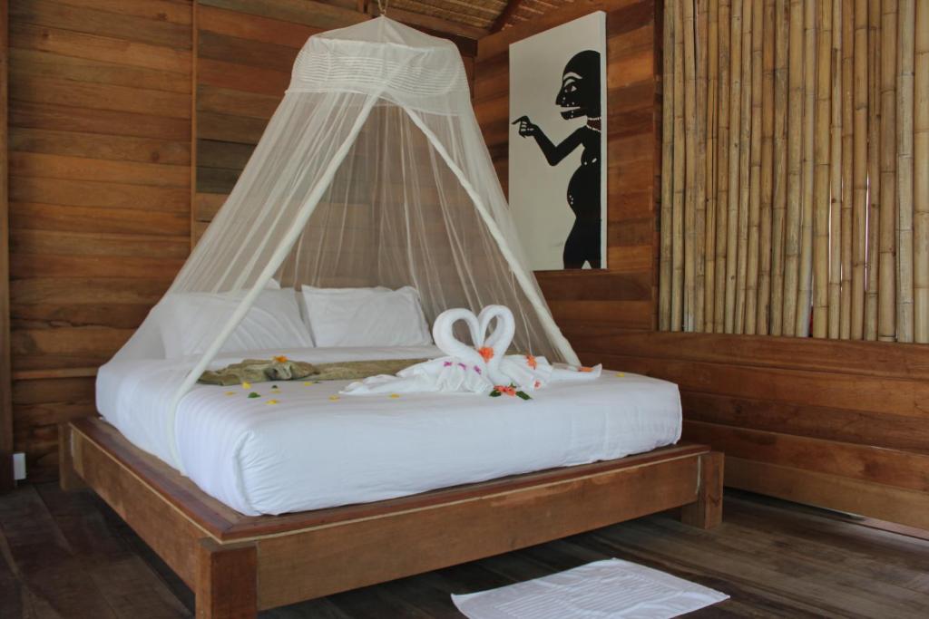 Postel nebo postele na pokoji v ubytování Koh Pu Villa