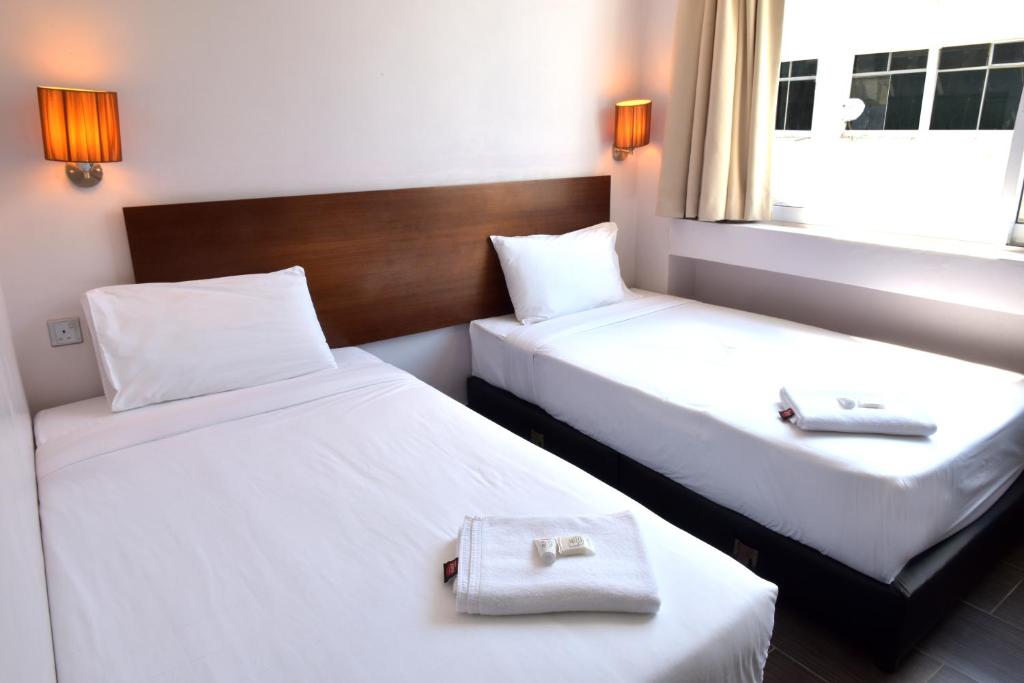 Postel nebo postele na pokoji v ubytování Tune Hotel - Waterfront Kuching