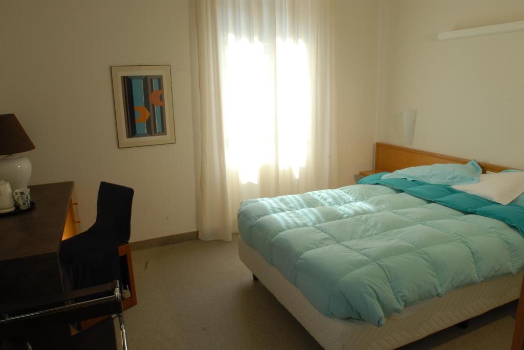 Łóżko lub łóżka w pokoju w obiekcie Albergo Al Sole