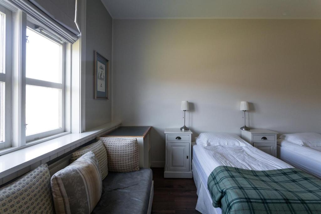 Posteľ alebo postele v izbe v ubytovaní Hotel Búdir