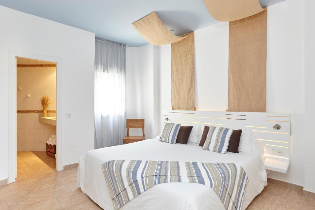 Postel nebo postele na pokoji v ubytování Apartamentos Castaví