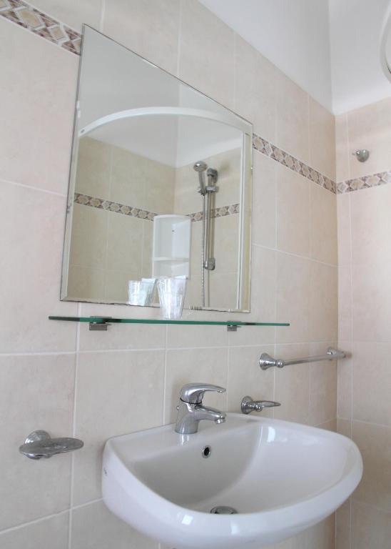 Koupelna v ubytování Hotel Universo
