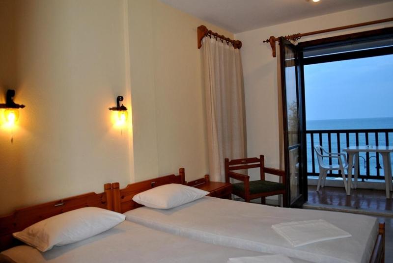 Postel nebo postele na pokoji v ubytování Hotel Maro