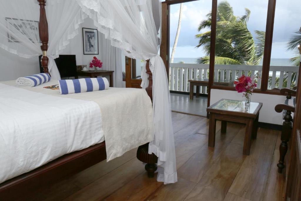 Postel nebo postele na pokoji v ubytování Sea World Boutique Hotel