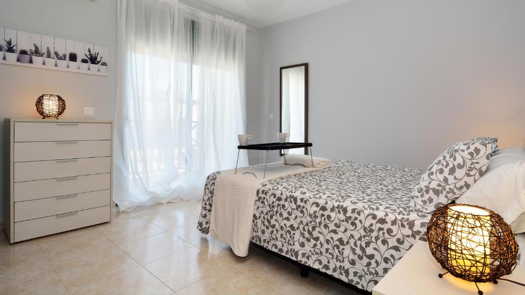 Postel nebo postele na pokoji v ubytování Villa Isla Feliz