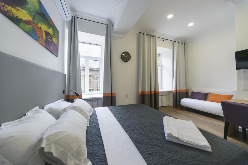Postel nebo postele na pokoji v ubytování Partner Guest House Khreschatyk