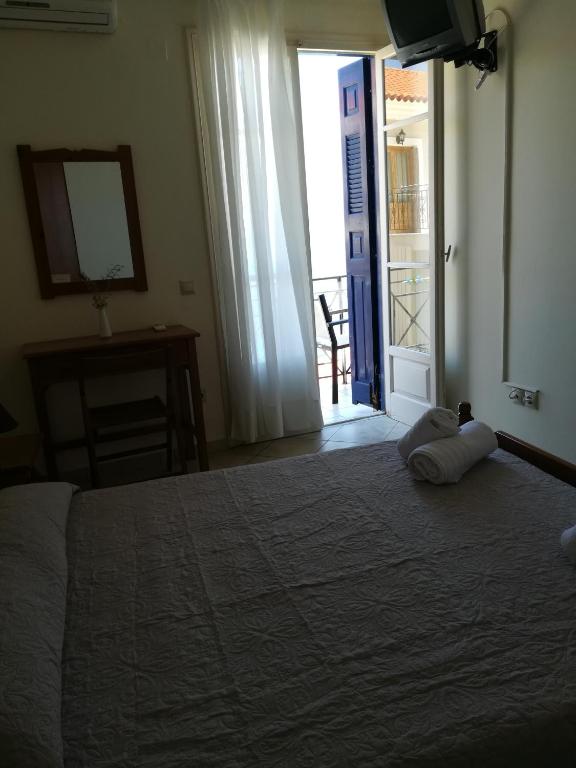 Postel nebo postele na pokoji v ubytování Ta Adelfia