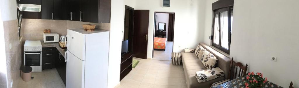 Kuchyň nebo kuchyňský kout v ubytování Paradiso Apartments - Liman1