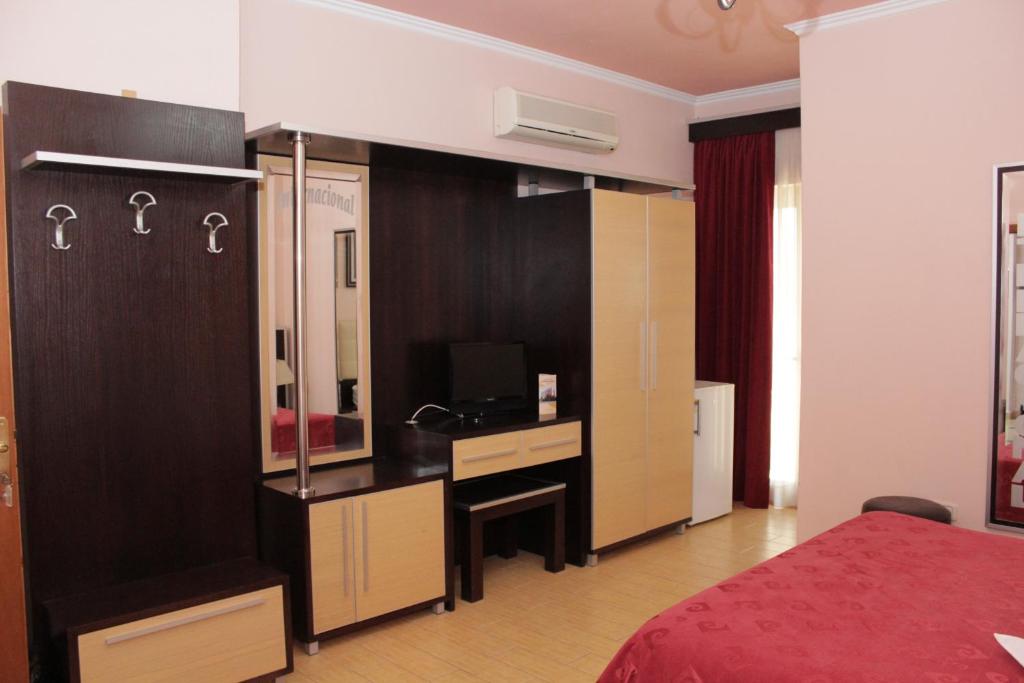 Postel nebo postele na pokoji v ubytování Fieri International Hotel