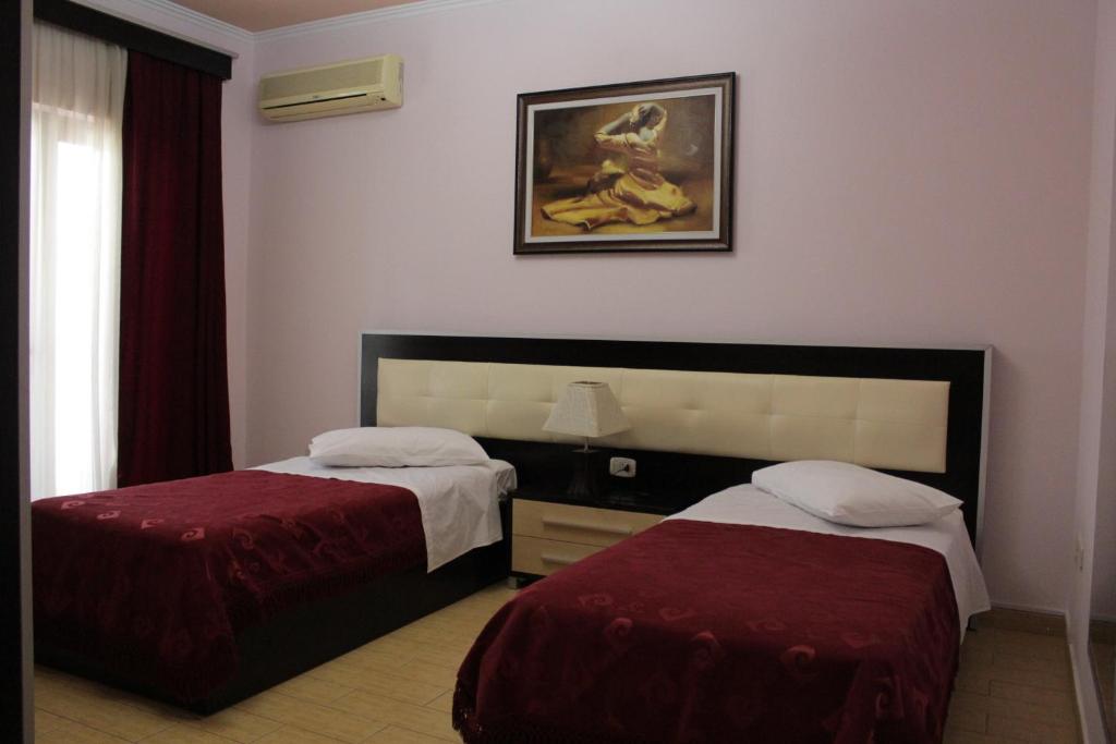 Postel nebo postele na pokoji v ubytování Fieri International Hotel