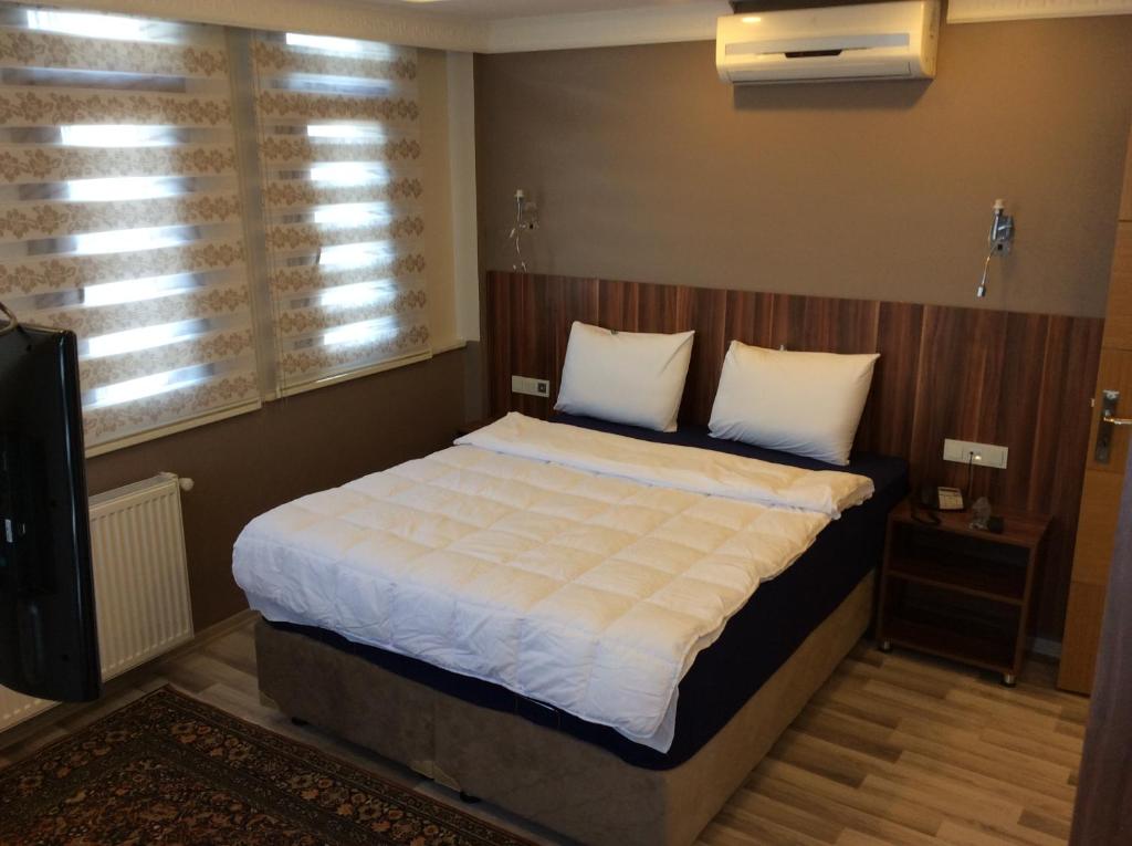 Postel nebo postele na pokoji v ubytování Hotel Yonca