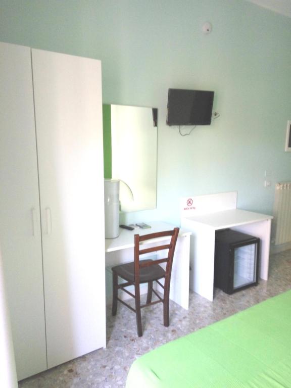 A television and/or entertainment centre at Michelangelo Rooms