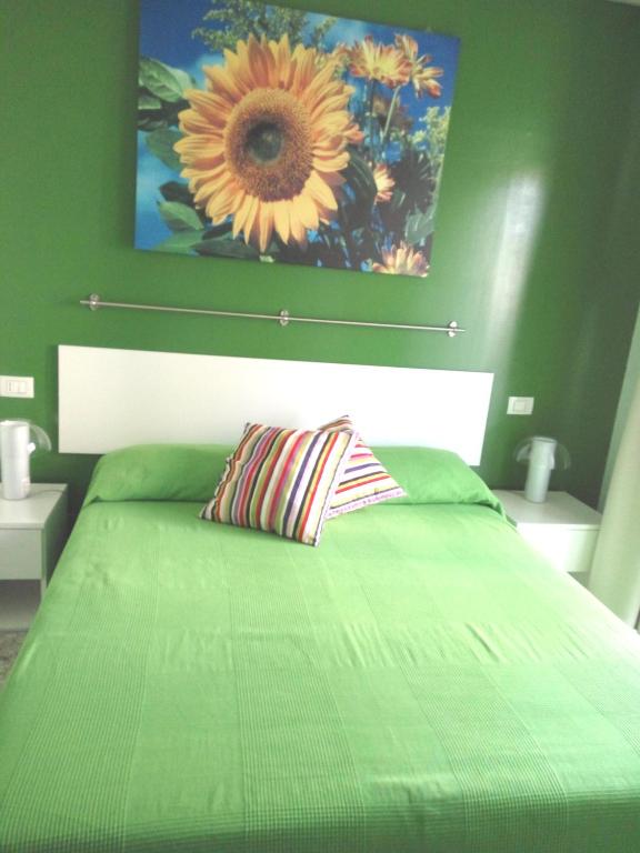 A bed or beds in a room at Michelangelo Rooms