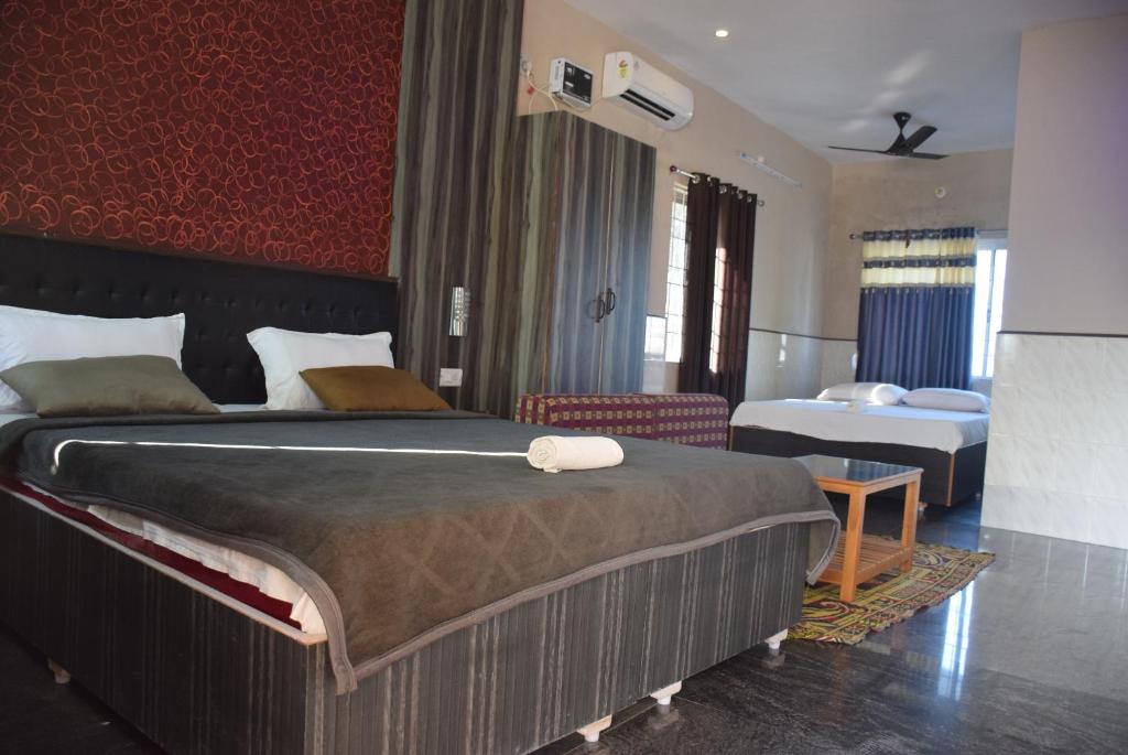 Letto o letti in una camera di Vinodhara Guest House