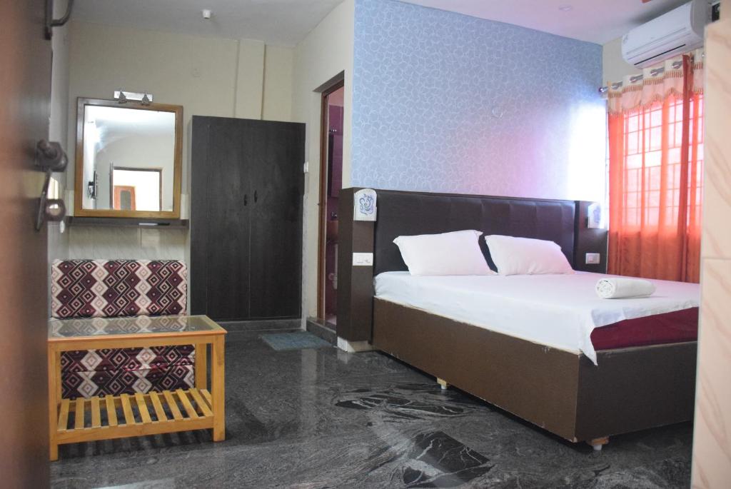 Letto o letti in una camera di Vinodhara Guest House