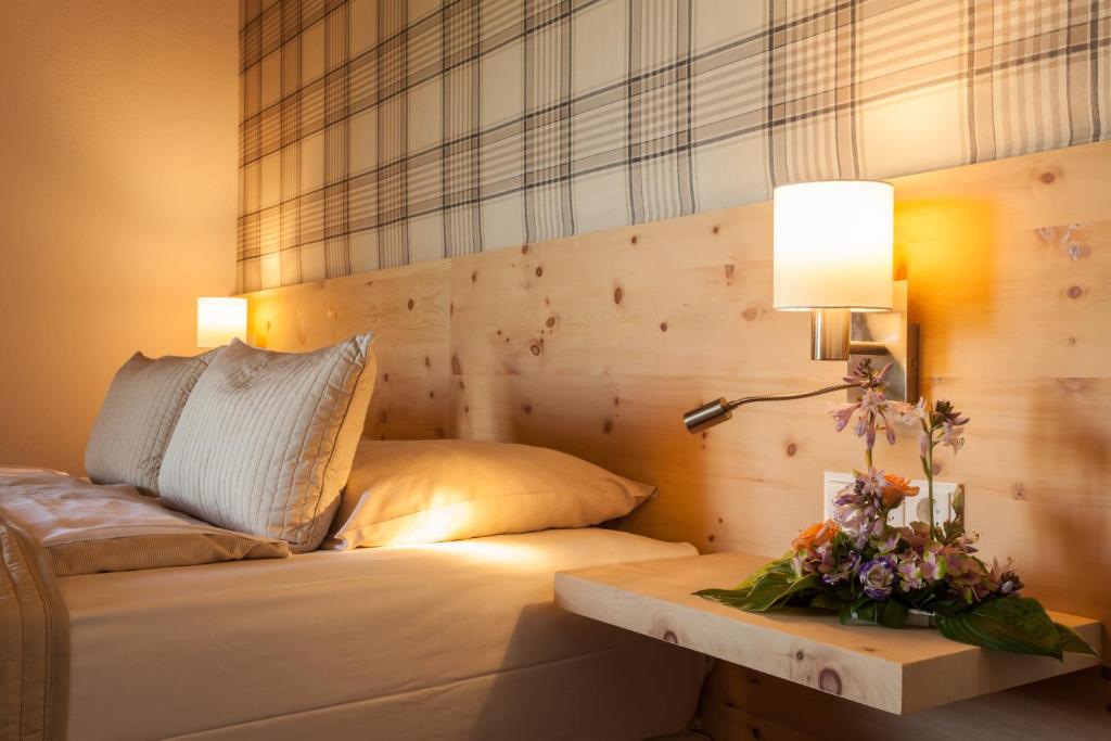 Posteľ alebo postele v izbe v ubytovaní Hotelresort Klopeinersee