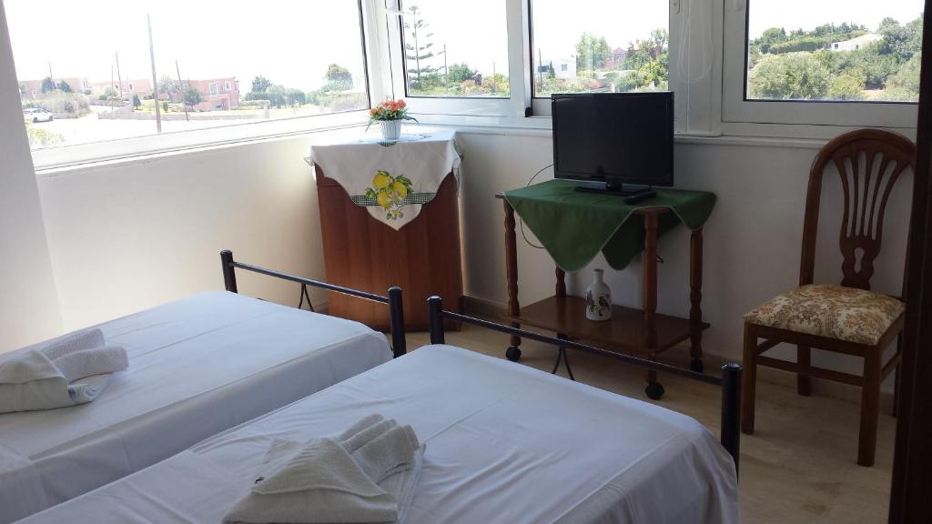 Postel nebo postele na pokoji v ubytování Eva Apartments