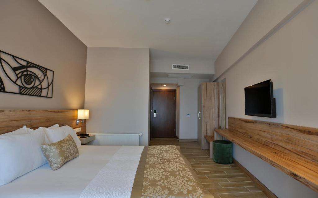 Postel nebo postele na pokoji v ubytování Kule Hotel