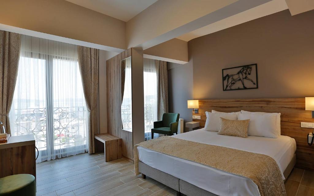 Postel nebo postele na pokoji v ubytování Kule Hotel