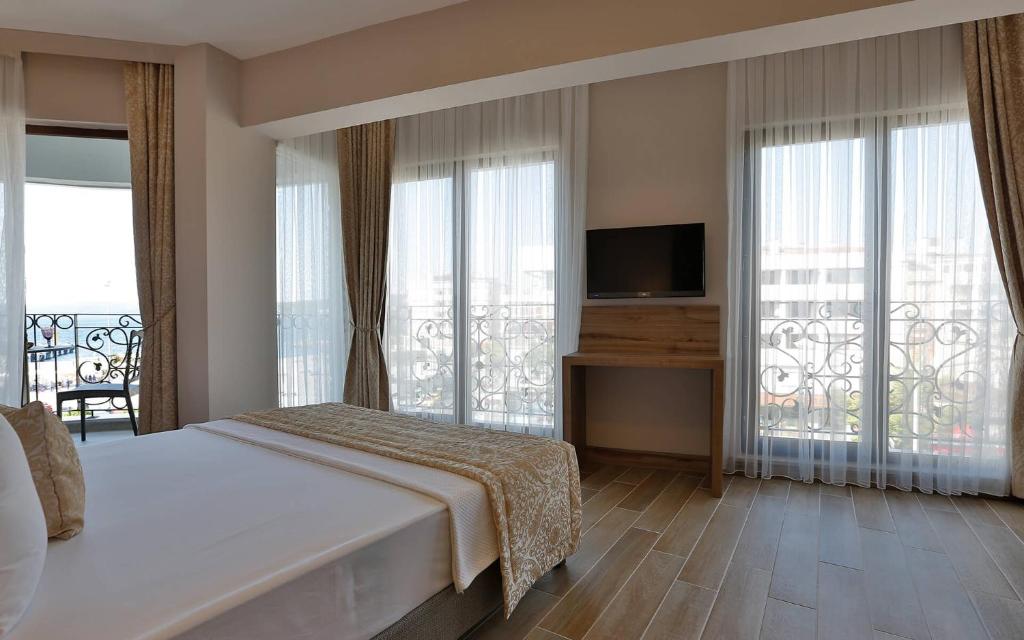 Postel nebo postele na pokoji v ubytování Kule Hotel