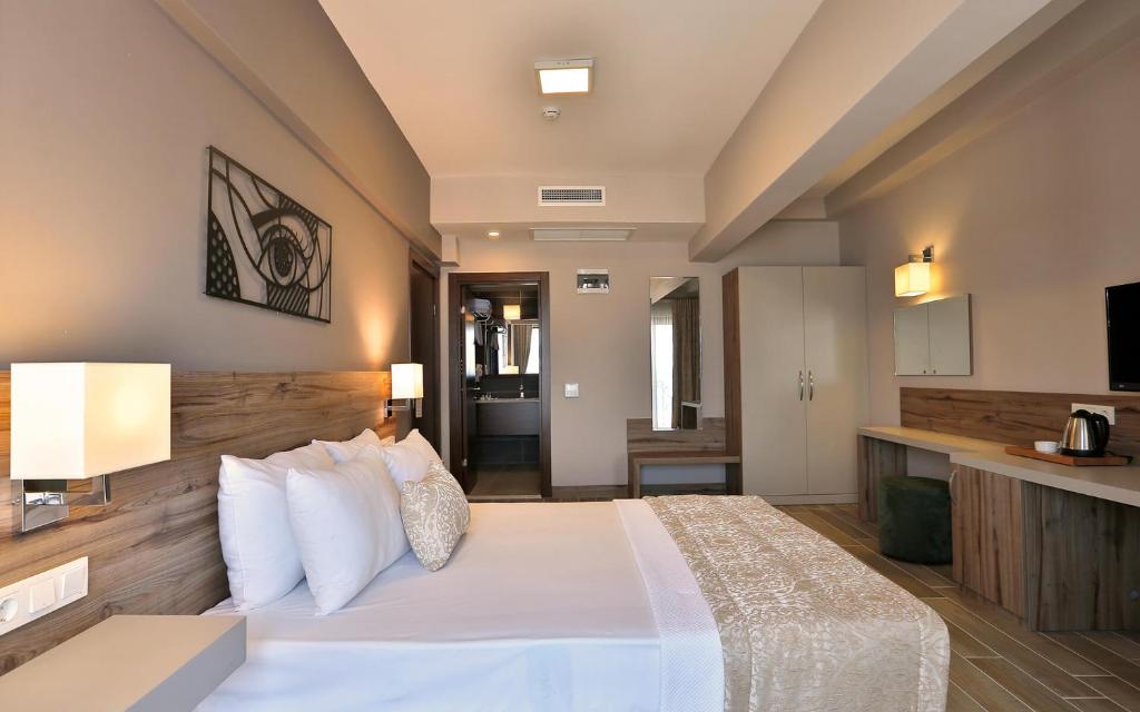 Postel nebo postele na pokoji v ubytování Kule Hotel