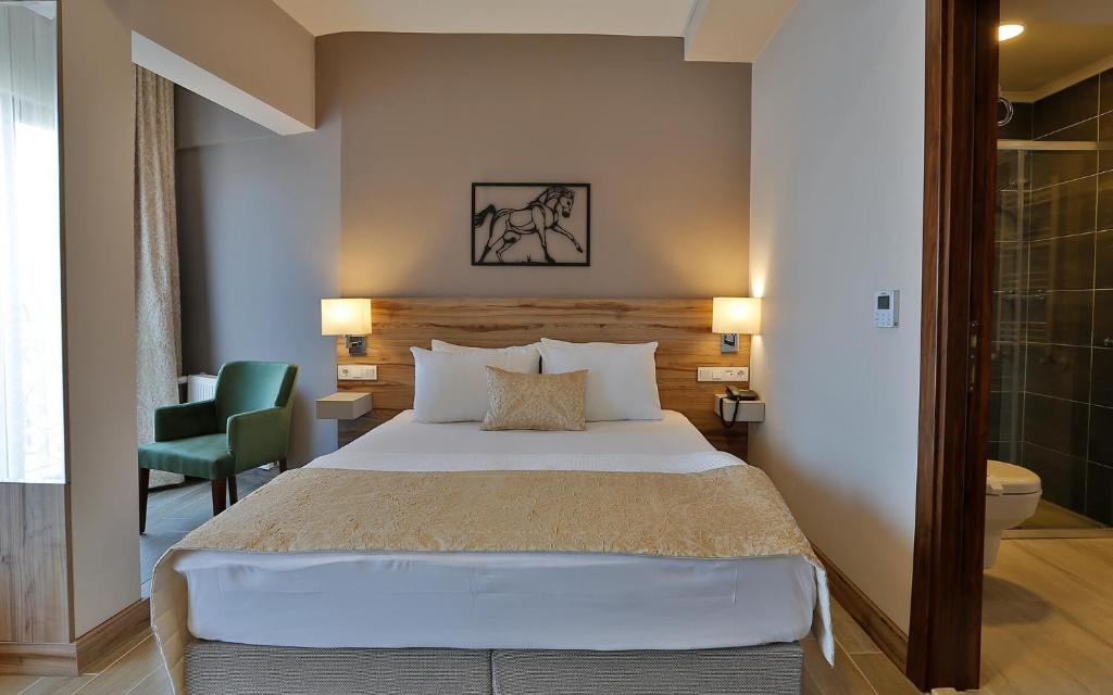 Postel nebo postele na pokoji v ubytování Kule Hotel