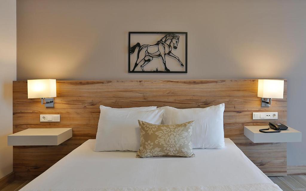 Postel nebo postele na pokoji v ubytování Kule Hotel