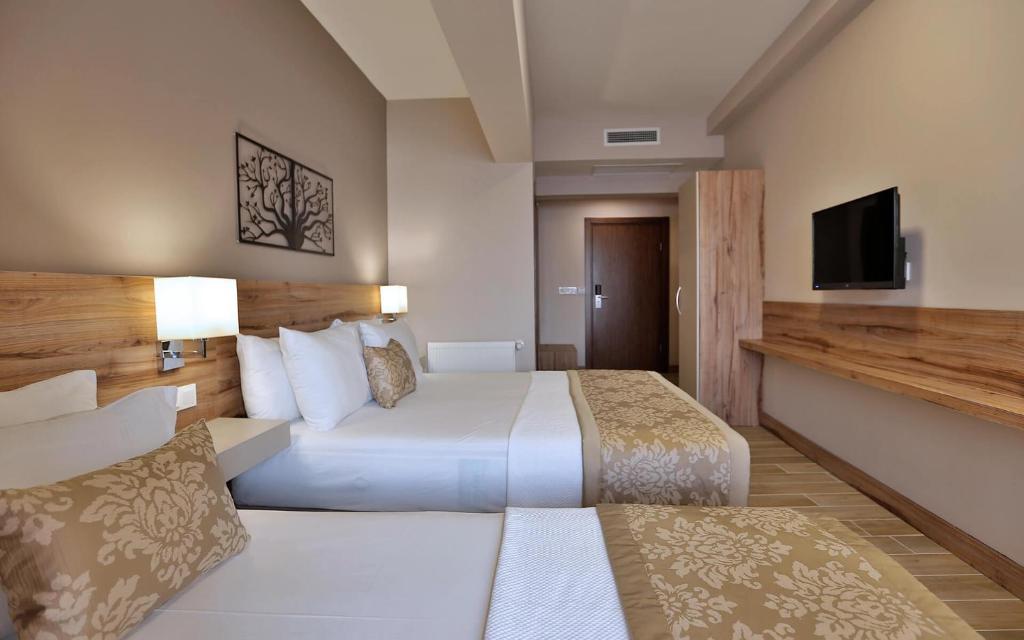 Postel nebo postele na pokoji v ubytování Kule Hotel