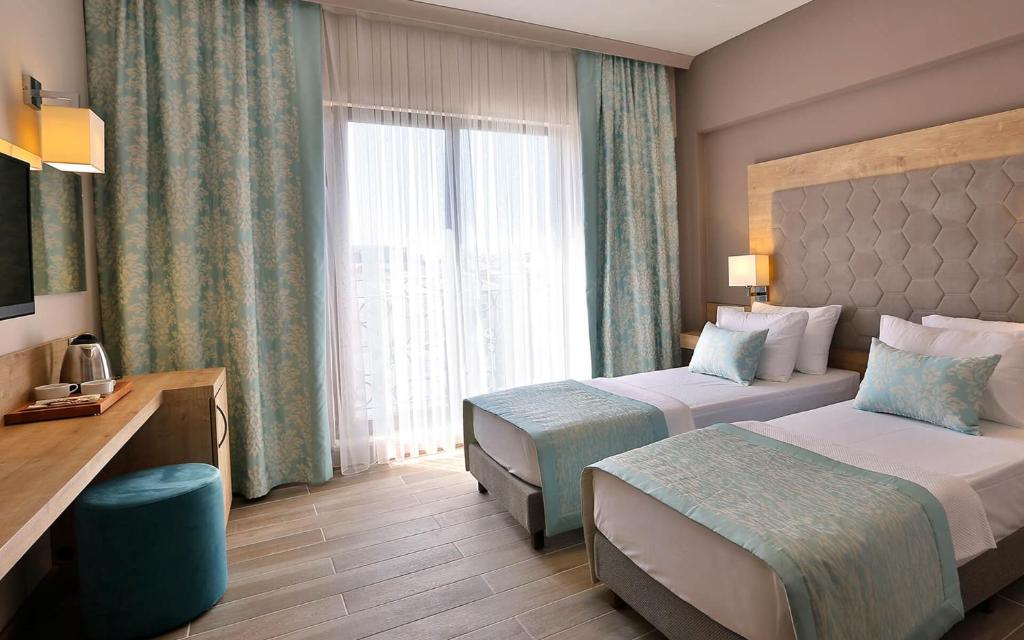 Postel nebo postele na pokoji v ubytování Kule Hotel