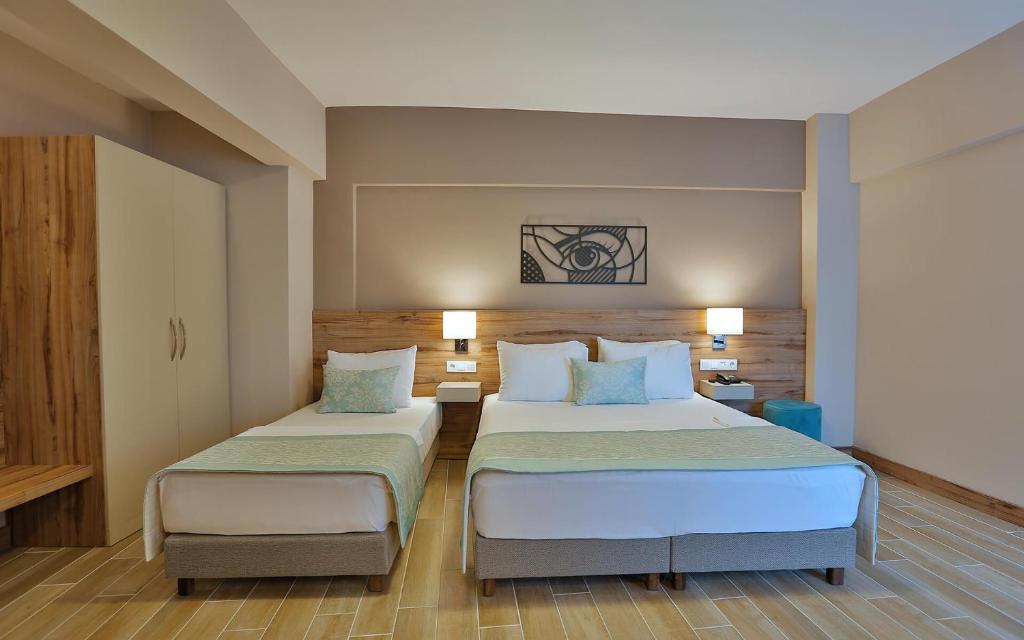 Postel nebo postele na pokoji v ubytování Kule Hotel