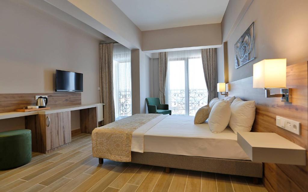 Postel nebo postele na pokoji v ubytování Kule Hotel