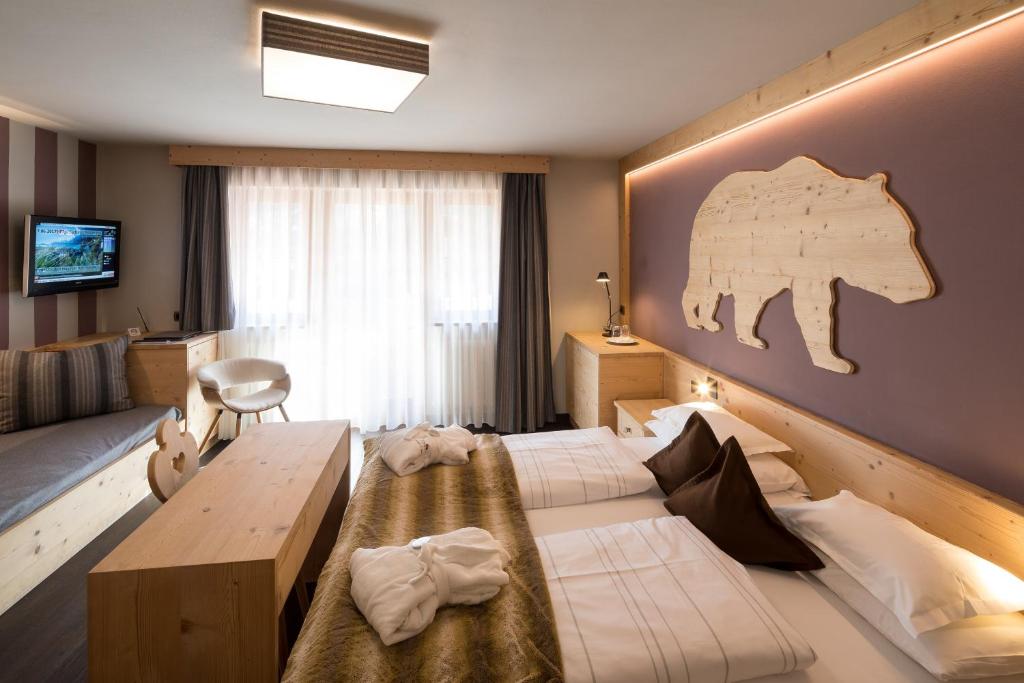 Postel nebo postele na pokoji v ubytování Hotel Somont