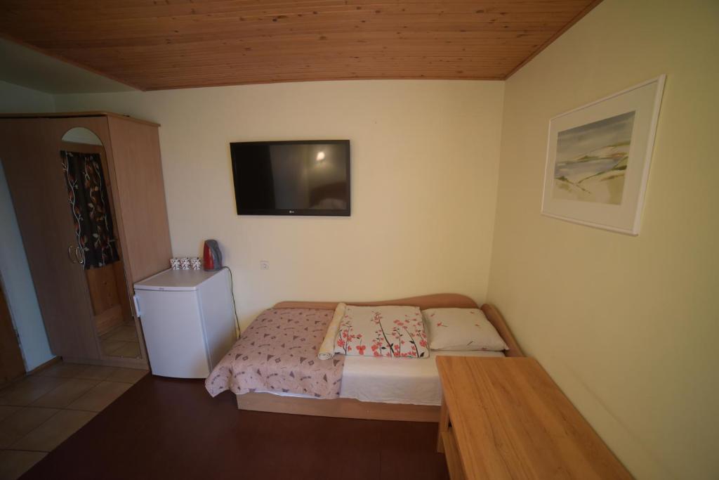 Postel nebo postele na pokoji v ubytování Inkliuzas