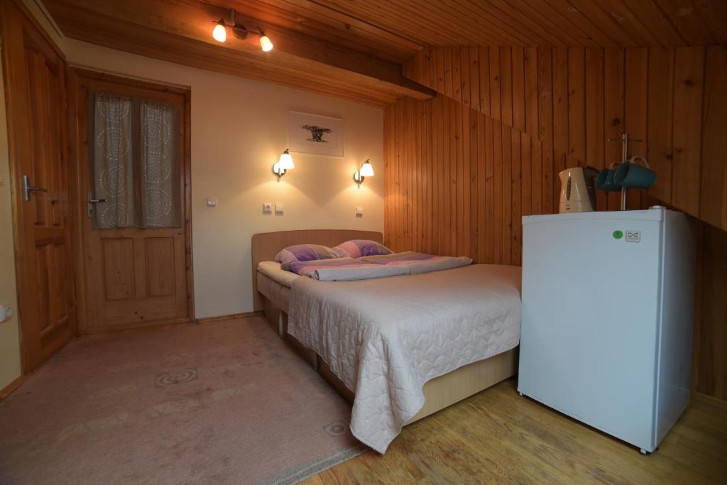 Postel nebo postele na pokoji v ubytování Inkliuzas