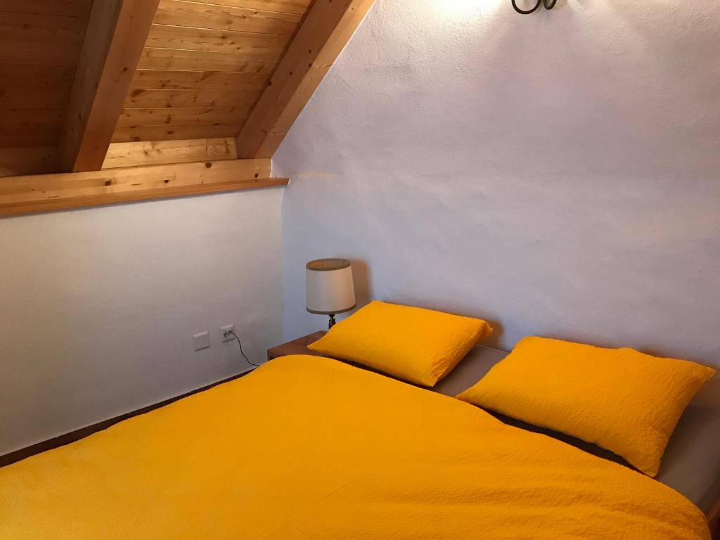 Postel nebo postele na pokoji v ubytování Rustici Maggia