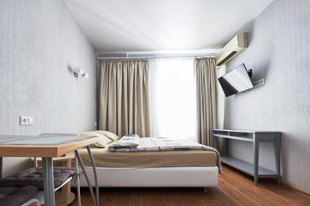 Una cama o camas en una habitación de Studio Apartment Luks