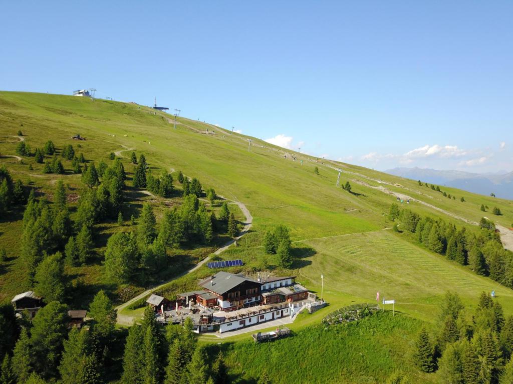 an aerial view of a large house on a hill at Rifugio Graziani Hütte in San Vigilio Di Marebbe