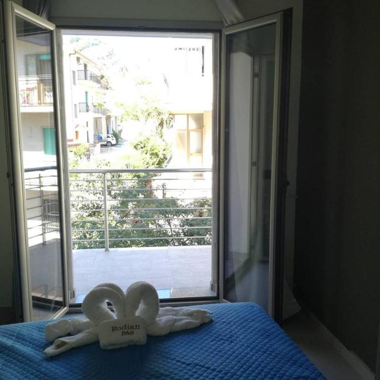 Postel nebo postele na pokoji v ubytování Hotel Rodian