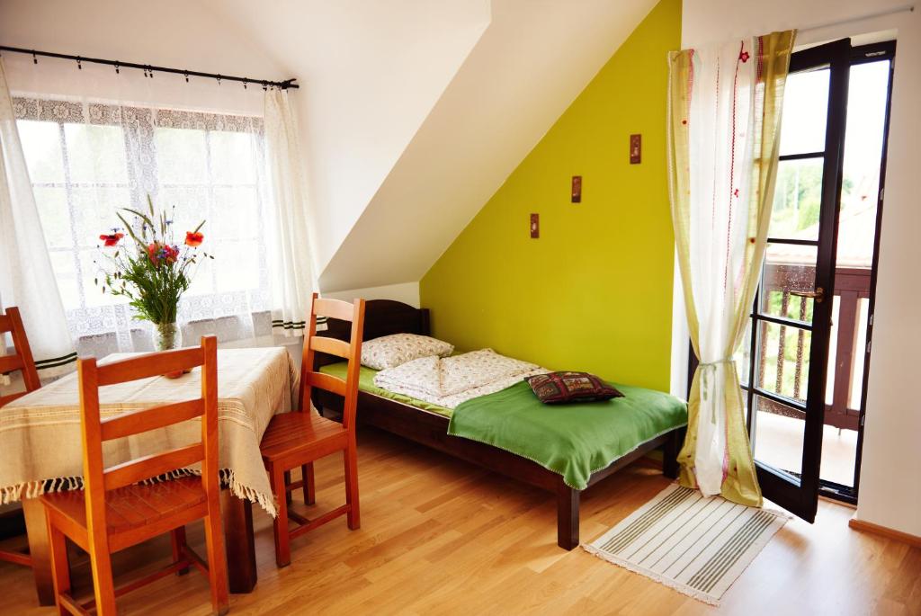 Postel nebo postele na pokoji v ubytování Willa Cicho Sza