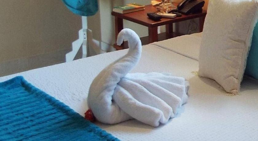 Postel nebo postele na pokoji v ubytování Hotel La Gaviota Tropical