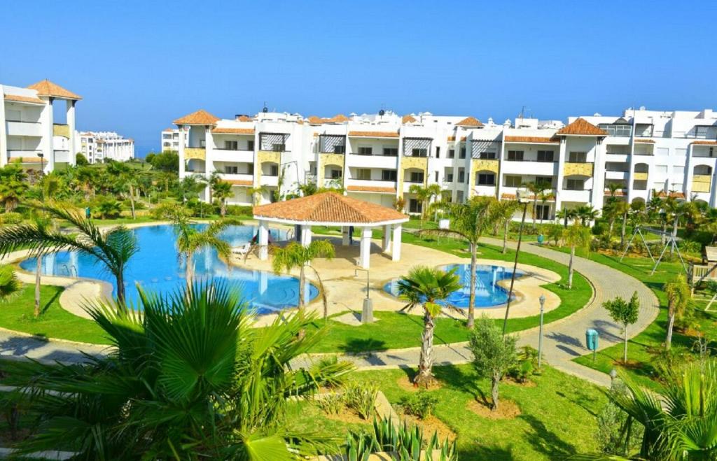 an aerial view of a resort with a swimming pool at Marina Golf Assilah in Asilah