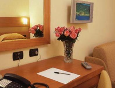 Postel nebo postele na pokoji v ubytování Hotel Moscatello