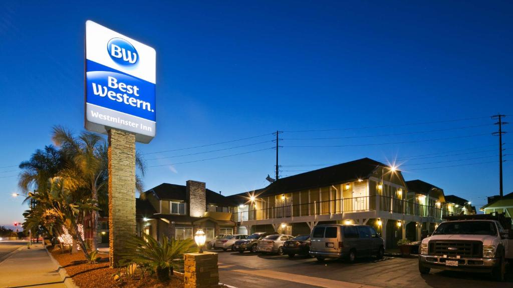 a sign for the best western in a parking lot at Best Western Westminster Inn in Westminster