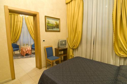 Posteľ alebo postele v izbe v ubytovaní Hotel Alba