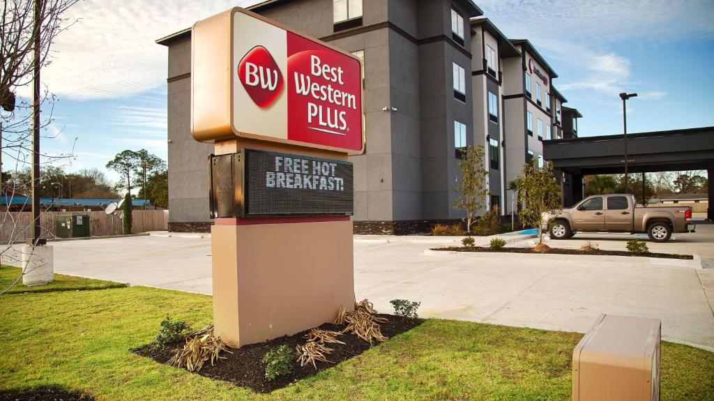 a best western plus sign in front of a building at Best Western Plus Prien Lake Hotel & Suites - Lake Charles in Lake Charles