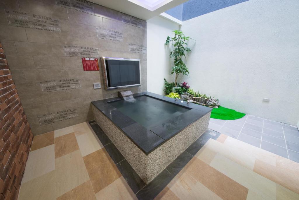 TV a/nebo společenská místnost v ubytování Ting-Shuai Motel