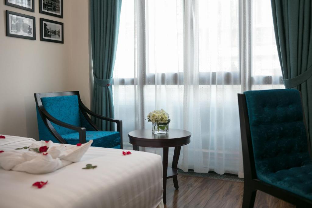 Postel nebo postele na pokoji v ubytování Serene Boutique Hotel & Spa