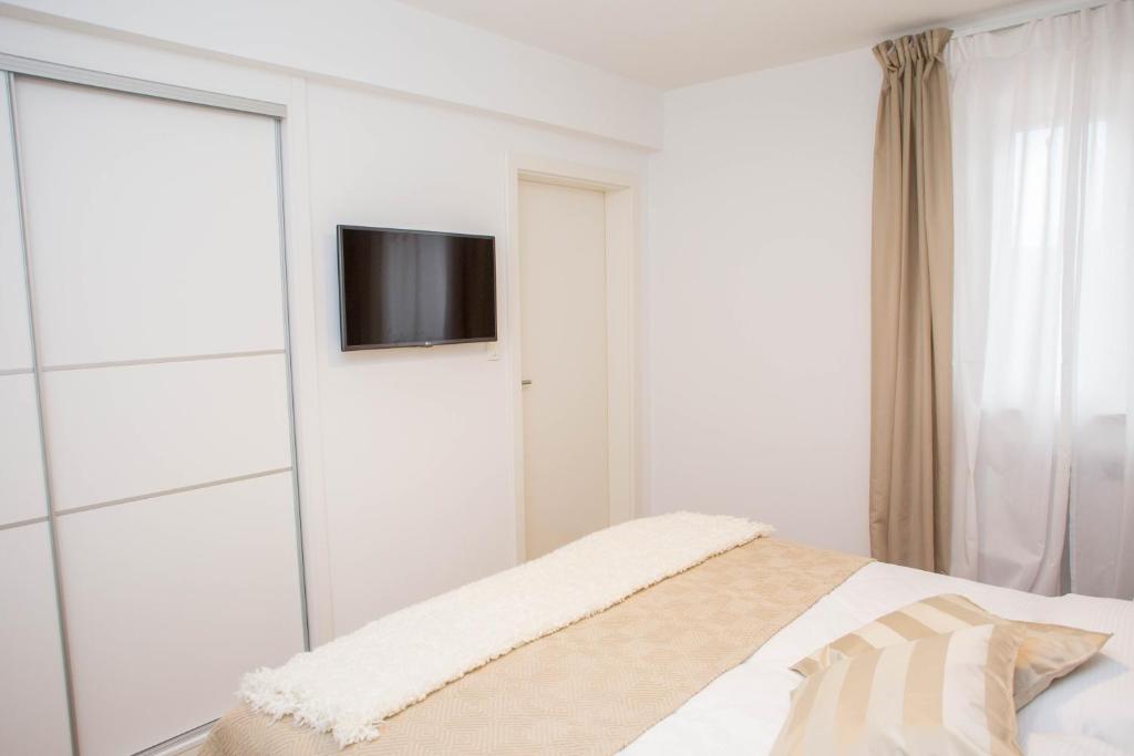 Postel nebo postele na pokoji v ubytování Villa Orljak